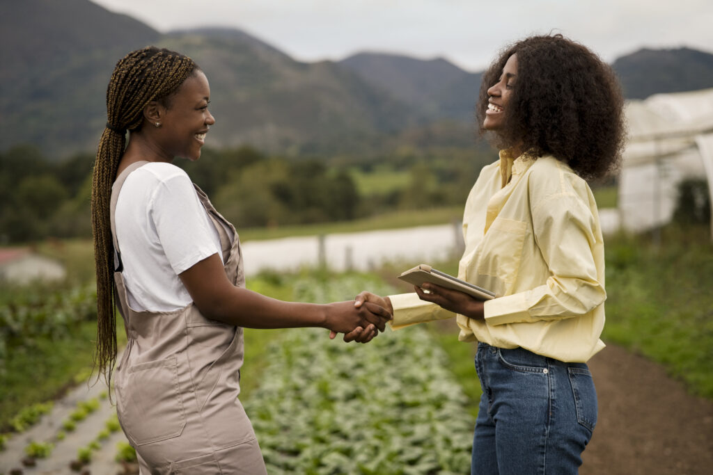 women-shaking-hands-side-view